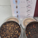 Sweet Chai Collection open, showing four loose leaf chai tea pouches, an acrylic bookmark, and a book pairing card