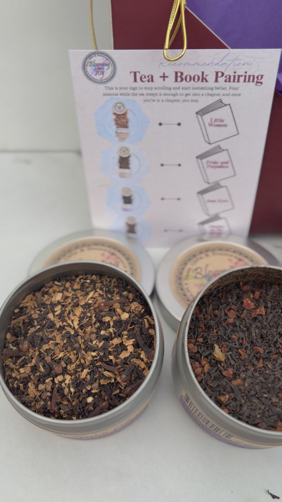 Sweet Chai Collection open, showing four loose leaf chai tea pouches, an acrylic bookmark, and a book pairing card