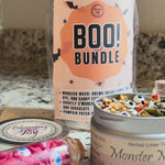 Monster Mash purple butterfly pea flower tea with candy monster eyes in a clear glass mug