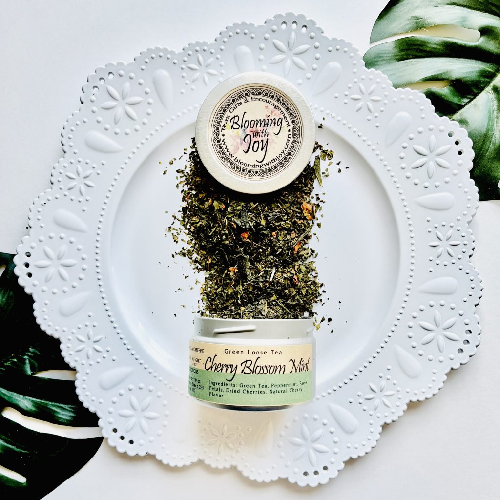 Indulge in the revitalizing blend of Cherry Blossom Mint loose leaf tea. Handcrafted in OβFallon, MO, this aromatic tea offers a moderate caffeine kick and is perfect for moments of relaxation.